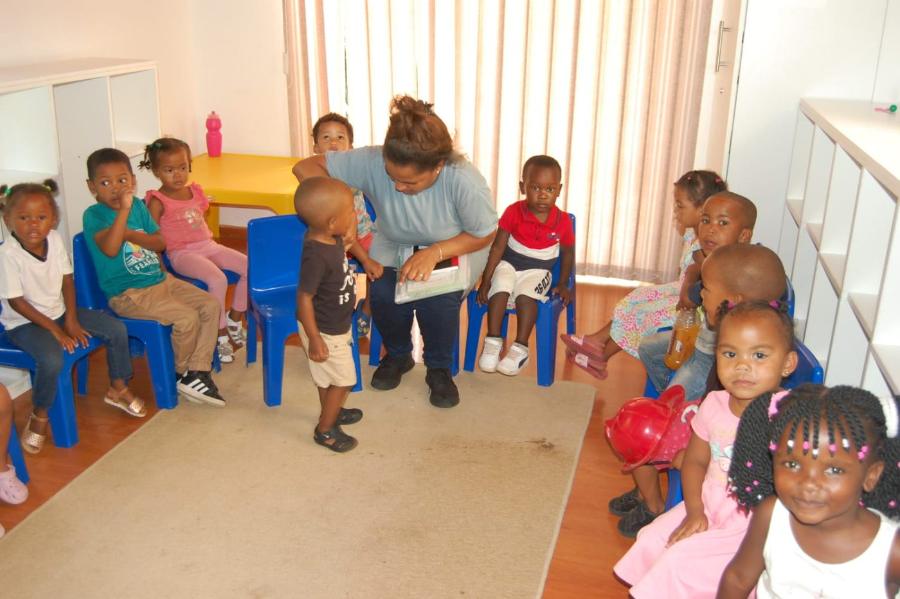 A teacher with children during circle time