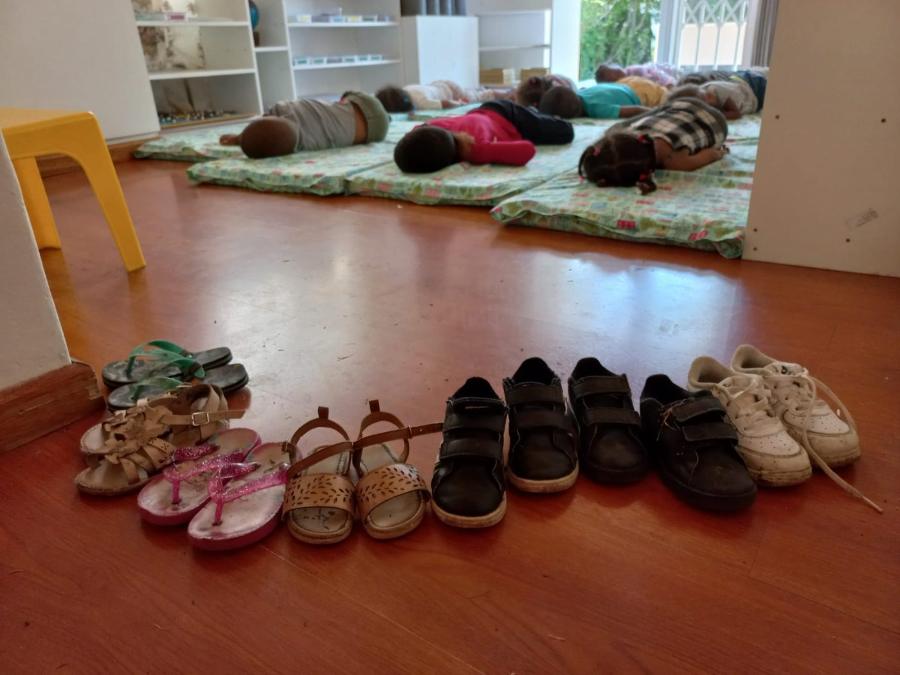Children resting, their shoes lined up